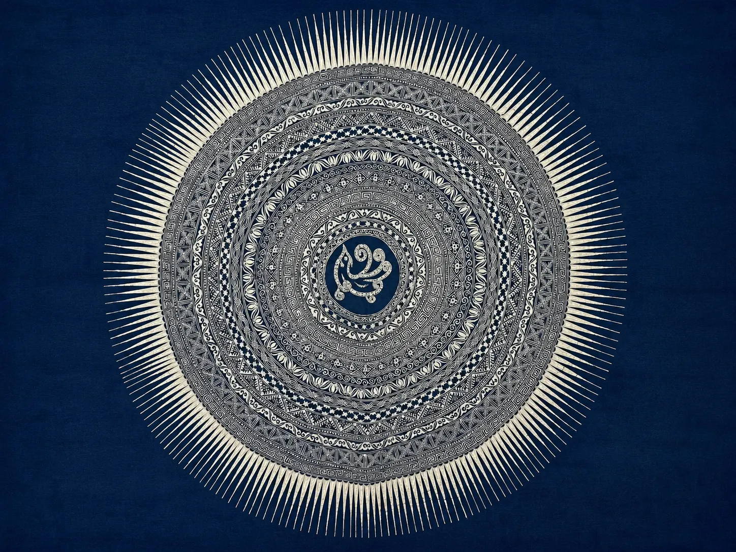 Geometric and sun motifs in handmade indigo batik