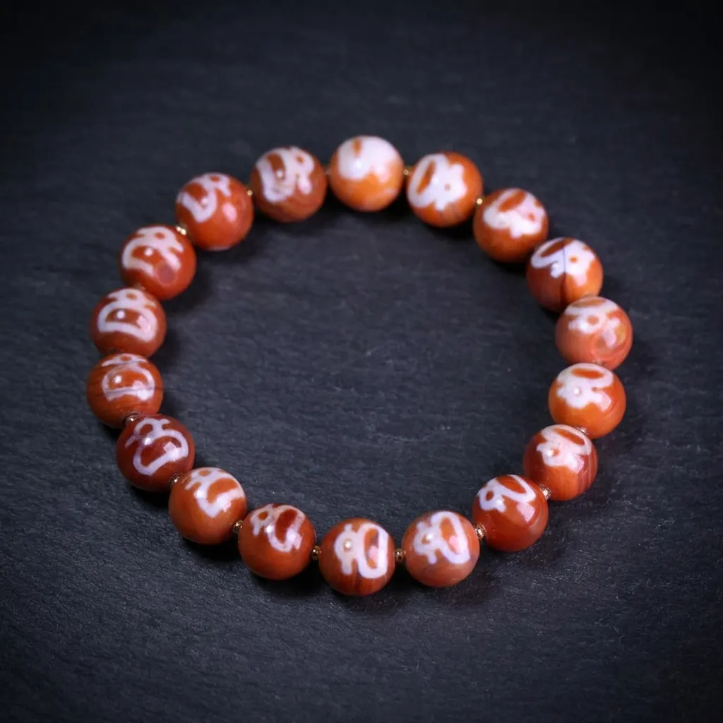 Eternal Wisdom: Handcrafted Tibetan Red Agate Dzi Bead Bracelet Wealth God (Kubera) Motif