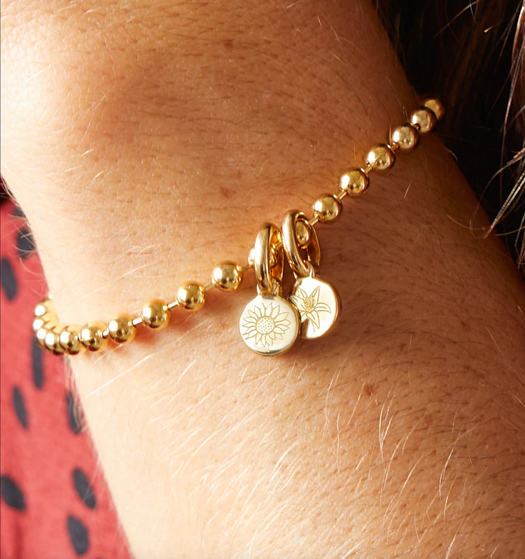 Beaded Bracelet with Two Mini Flower Charms