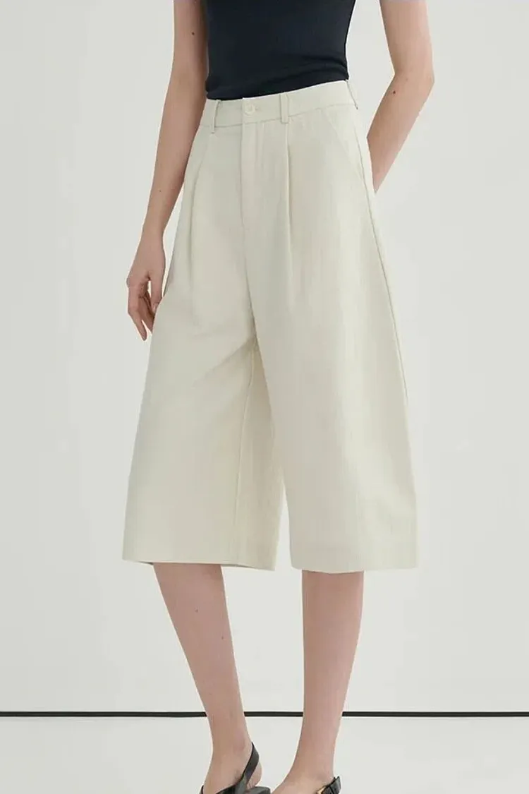 Cream-colored high-waisted wide-leg shorts