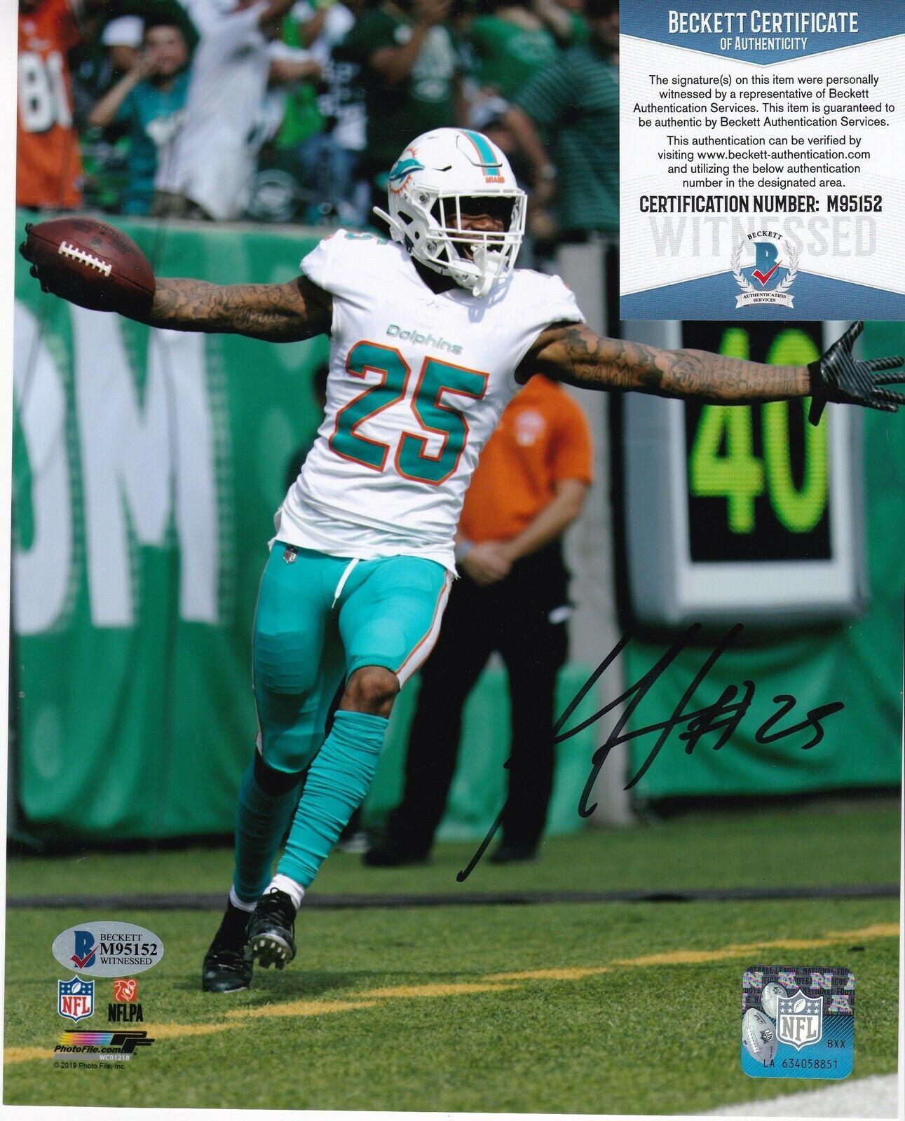 XAVIEN HOWARD MIAMI DOLPHINS BECKETT AUTHENTICATED ACTION SIGNED 8x10