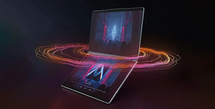 Yoga Book 9i Gen 8 (Intel da 13 pollici) completamente aperto con lo schermo acceso e l'audio proveniente dalla soundbar