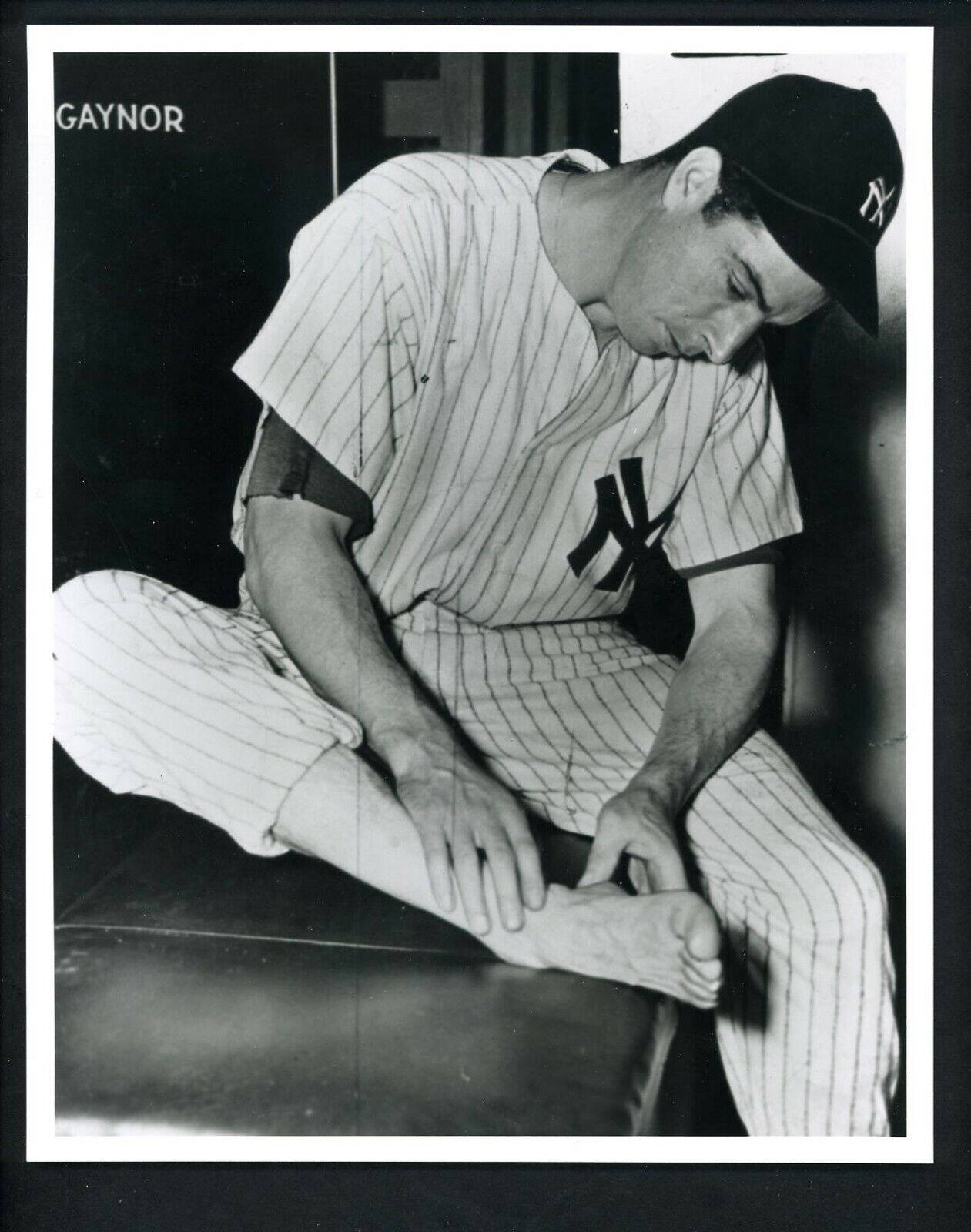 Joe DiMaggio examines injured heel 1940's Type IV Press Photo Poster painting New York Yankees