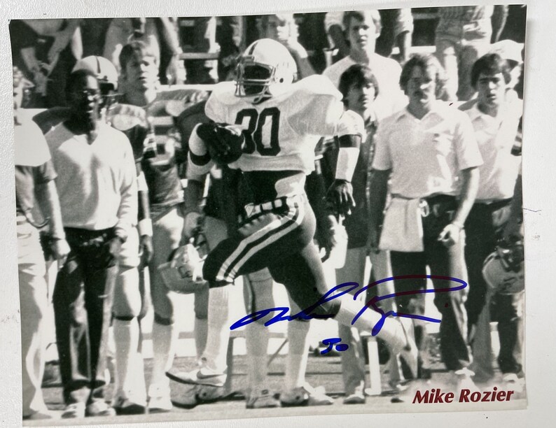 Mike Rozier Signed Autographed Glossy 8x10 Photo Poster painting Nebraska Cornhuskers - COA Matching Holograms