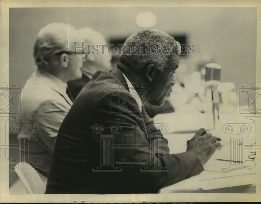 Press Photo Poster painting Baseball player Jackie Robinson sits at meeting table with others