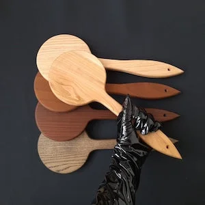 pornhint Pornhint Round BDSM spanking paddle with a sharp end on the handle