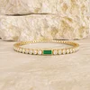 14K Yellow Gold Round Lab Diamond Bezel Setting Tennis Bracelet with A Baguette Cut Lab Emerald  Center Stone