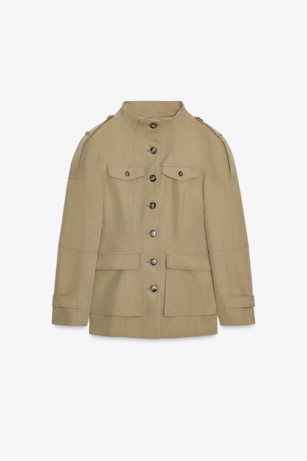 Front view of a light khaki jacket with a stand-up collar, long sleeves, patch pockets with flaps, and button closure.