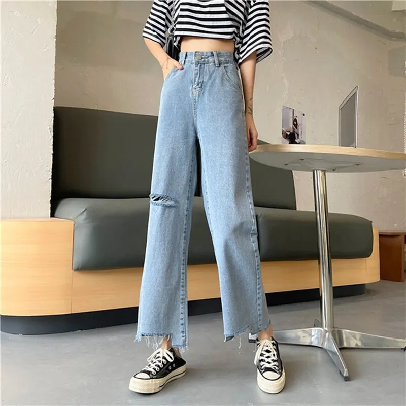 Ripped High Waist jeans for Women in wide leg denim clothing. Quality fashion at vintage