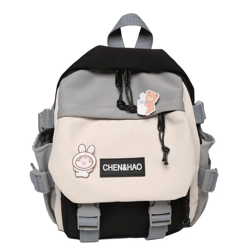 Fashion Preppy Style Women Cartoon Printing Contrast Color Backpack with Pendant Casual Girls Students Travel Schoolbag Knapsack