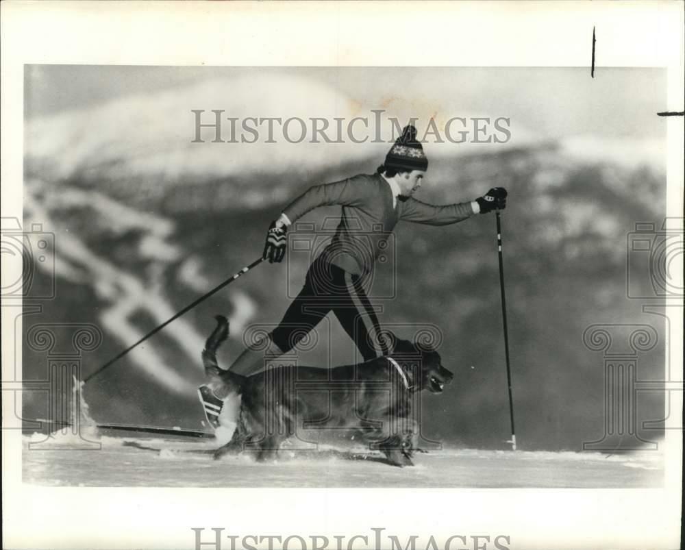 Press Photo Poster painting Man skiing with Dog in Montpelier, Vermont - sax29308