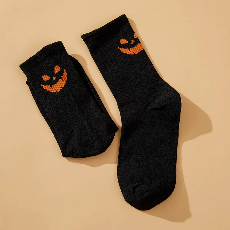 Solid color pumpkin face vertical print mid-calf socks