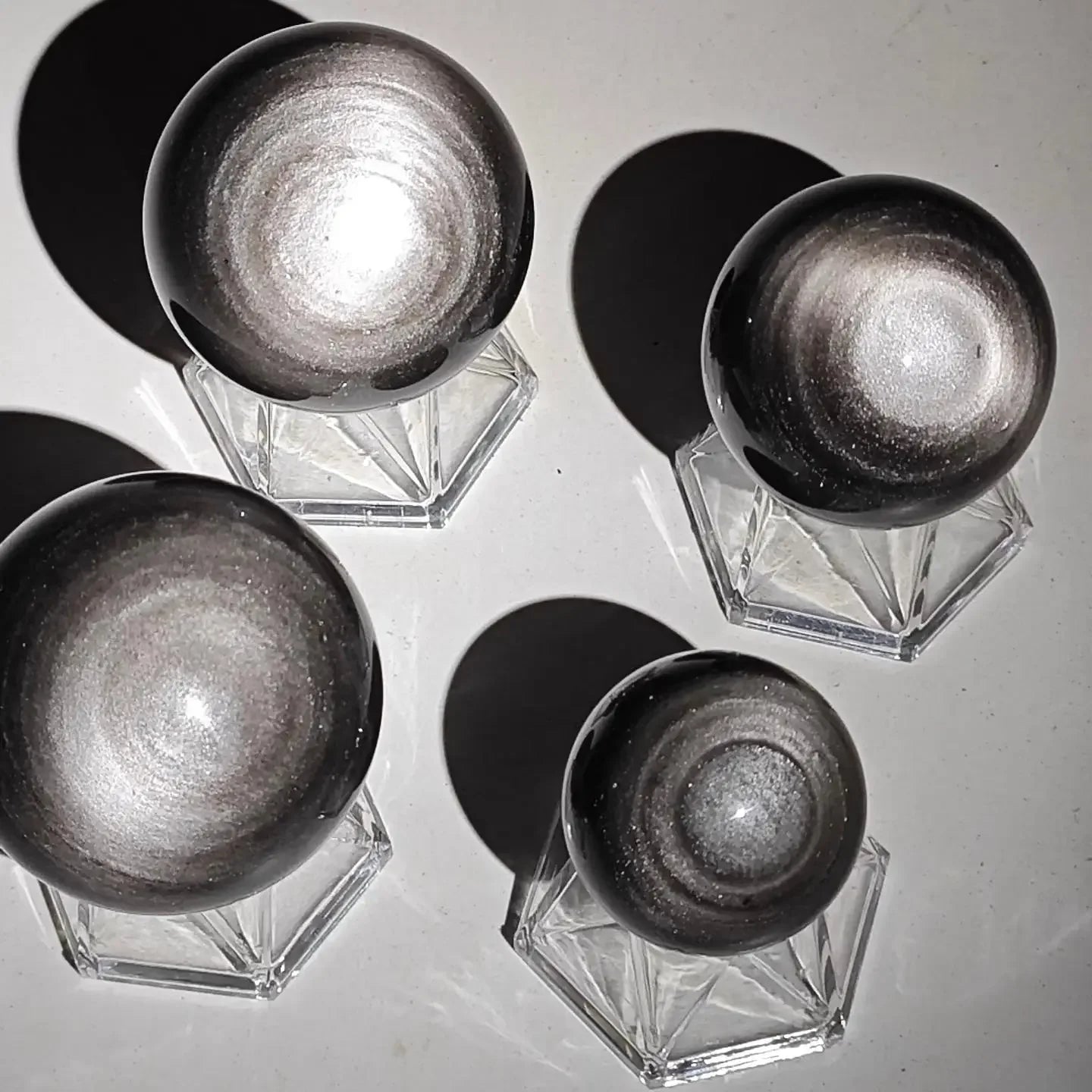 Natural markings on silver sheen obsidian