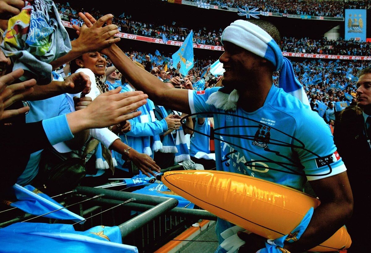 Vincent Kompany SIGNED Autograph in a Manchester City shirt 12x8 Photo Poster painting AFTAL COA