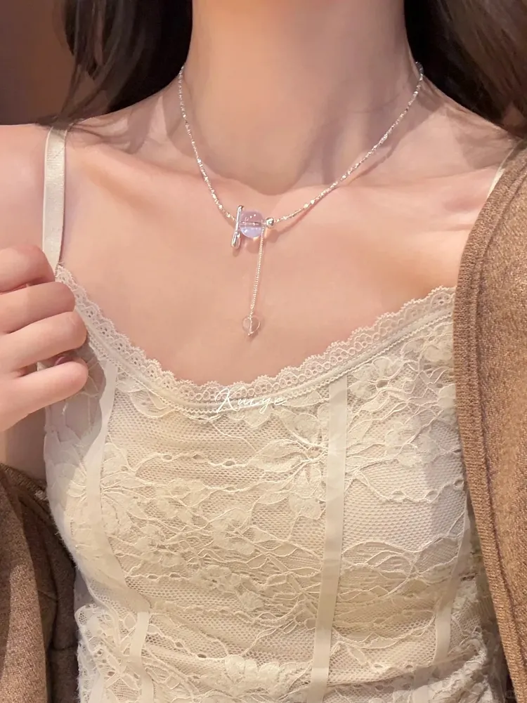 Necklace with unique tassel design and purple crystal embellishment