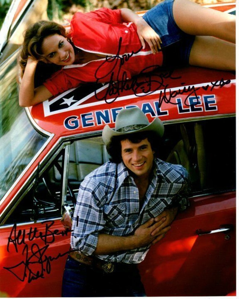 Catherine bach and tom wopat signed the dukes of hazzard 8x10 Photo Poster painting