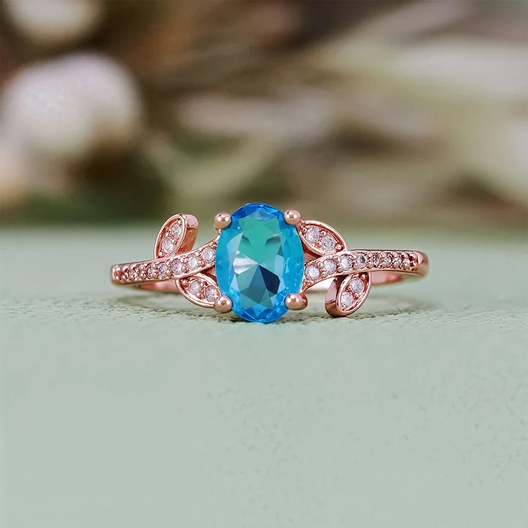 Olivenorma Oval Cut Blue Topaz Wrapped Leaf Ring