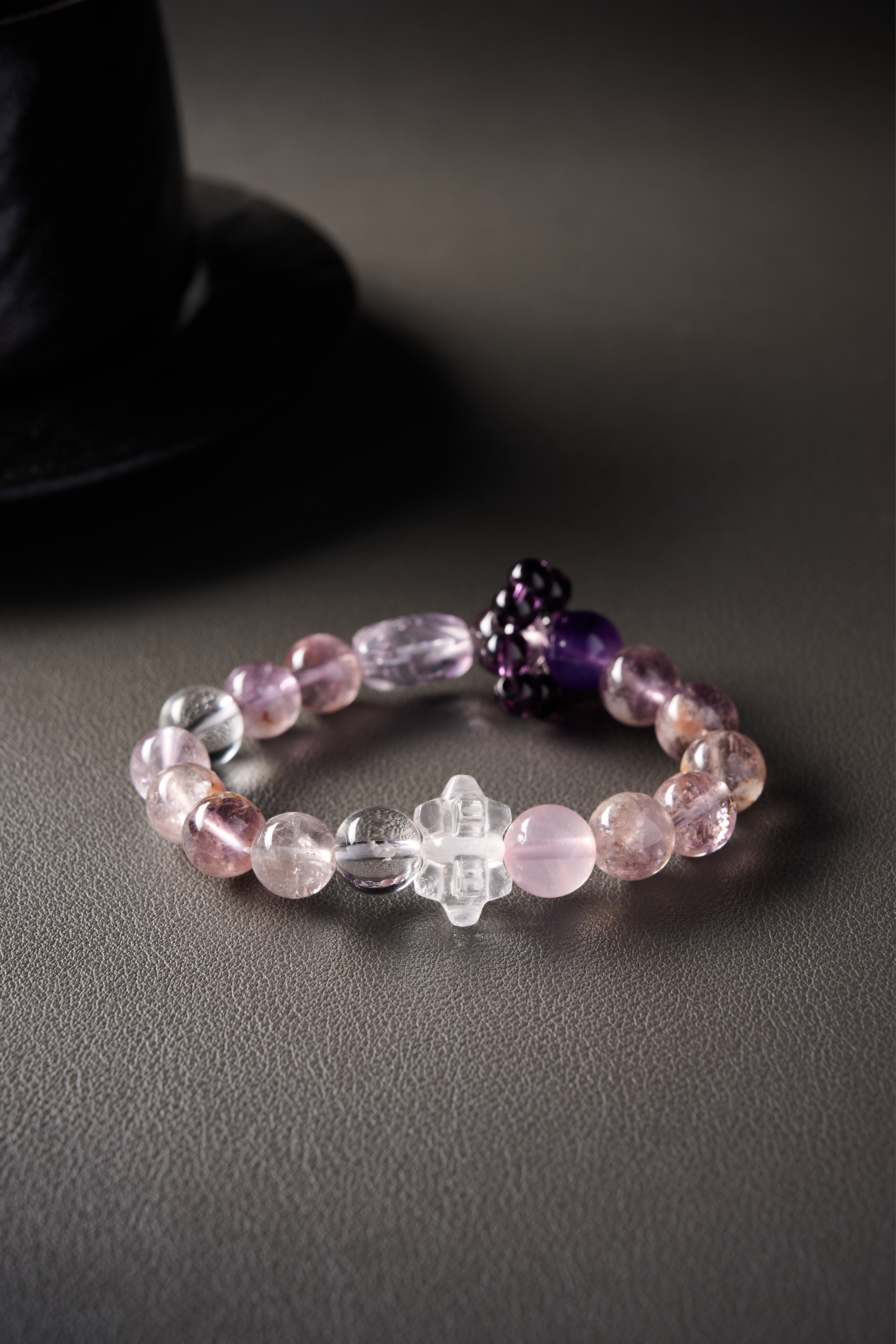 Close-up – rose quartz soft pink hue beside clear quartz, smooth texture and gentle shine.