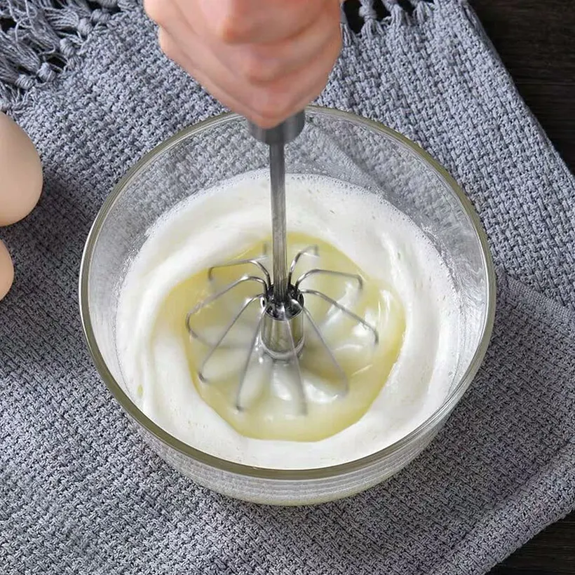 Whipping liquid egg whites and cream into foam
