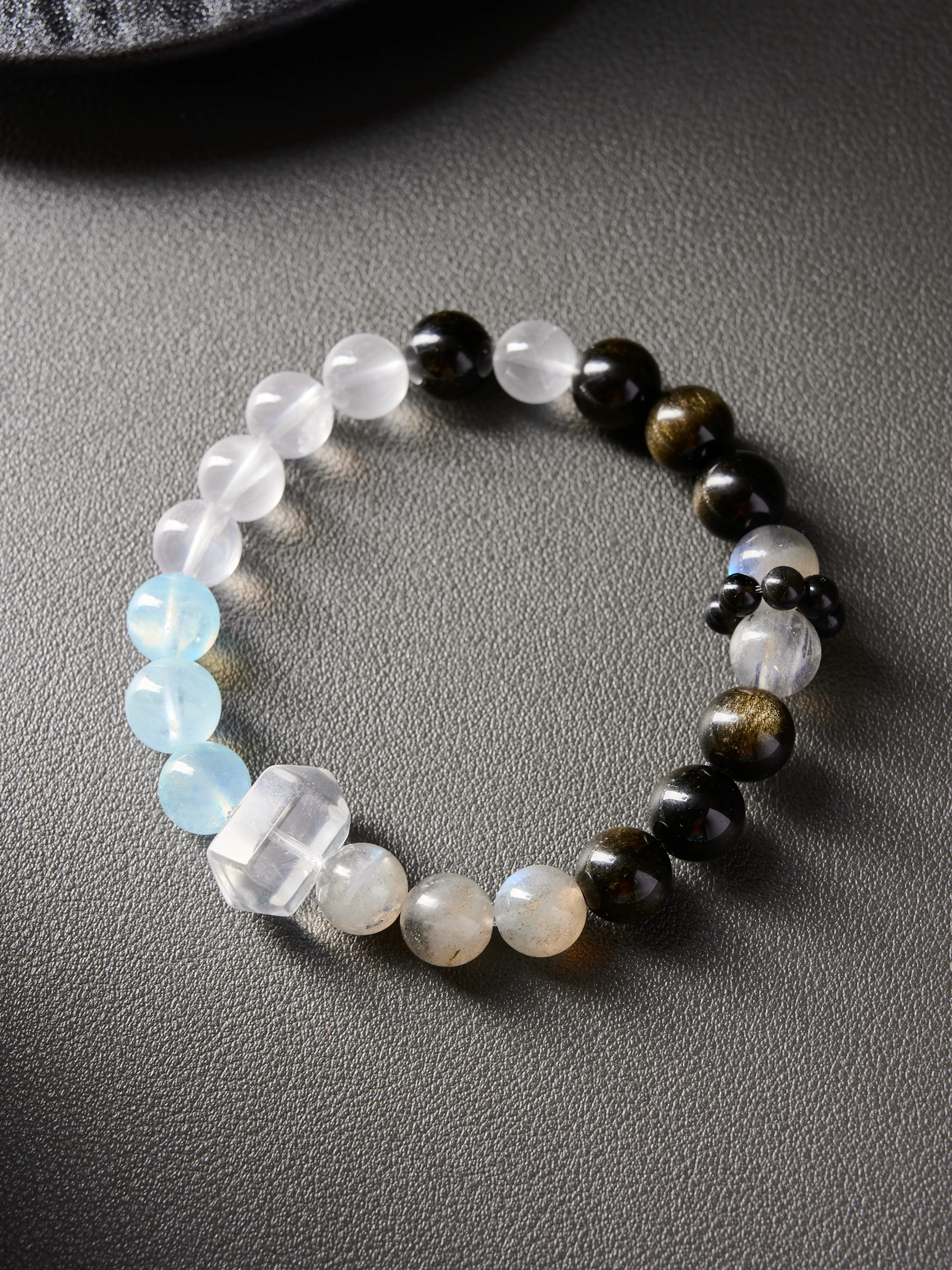 AvigJewelry grey moonstone and obsidian handcrafted bracelet, elastic 16–18 cm, front view