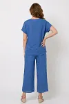Back view of women's cobalt blue linen resort suit showing relaxed fit top and high-waisted pants