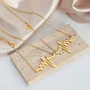 Golden Heartbeat Pendant Necklace