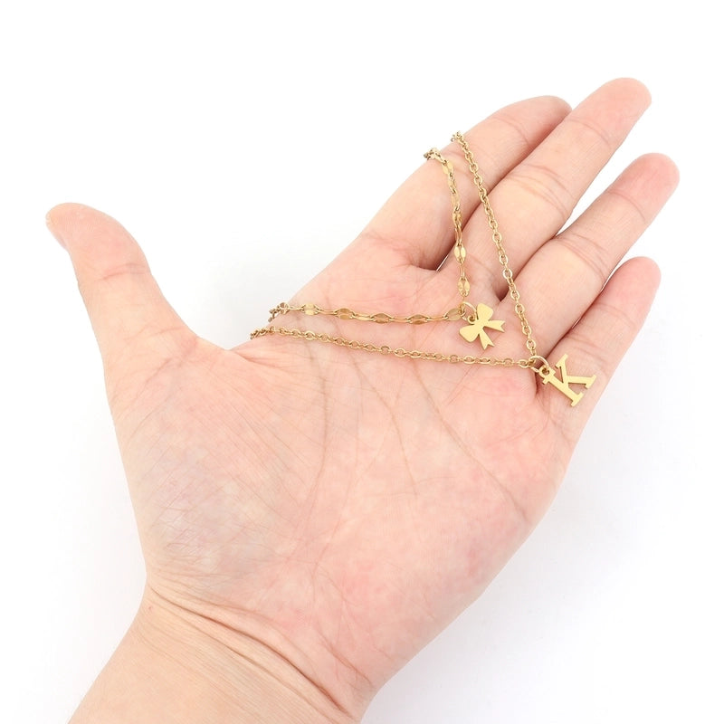 Elegant Minimalist Classic Style Letter Bow Knot 201 Stainless Steel 304 Stainless Steel Pendant Necklace