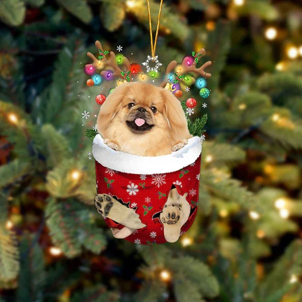 Pekingese In Snow Pocket Christmas Ornament.