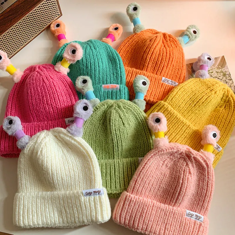Bonnet aux yeux de monstre brillants