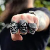 Bearded tough guy wearing hat skull rings for men