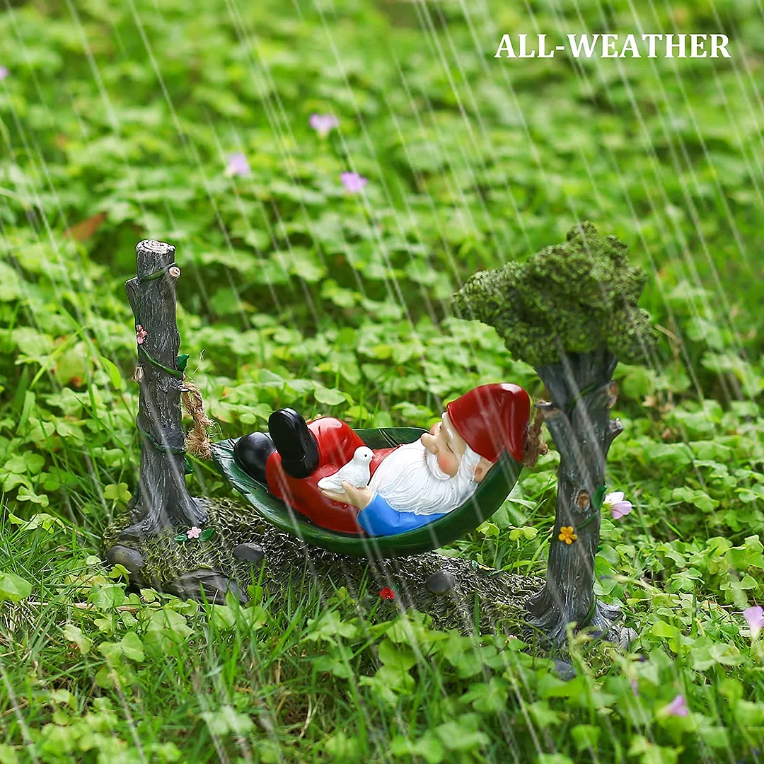 Garden Gnome Statue Lying In Hammock Hanging From Tree
