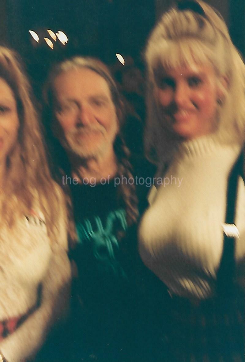 FOUND Photo Poster painting Color BLURRY WILLIE NELSON Original Snapshot PRETTY WOMEN 21 50 T