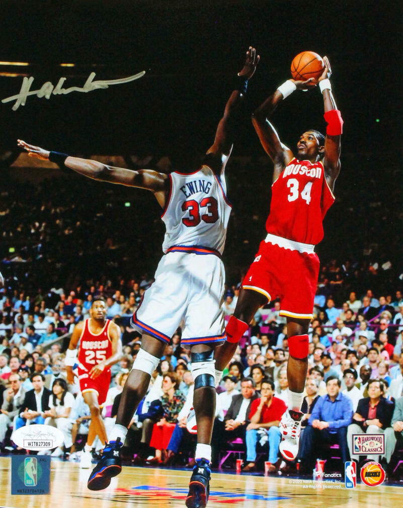 Hakeem Olajuwon Houston Rockets Autographed 8x10 V. Ewing Photo Poster painting- JSA W *Silver