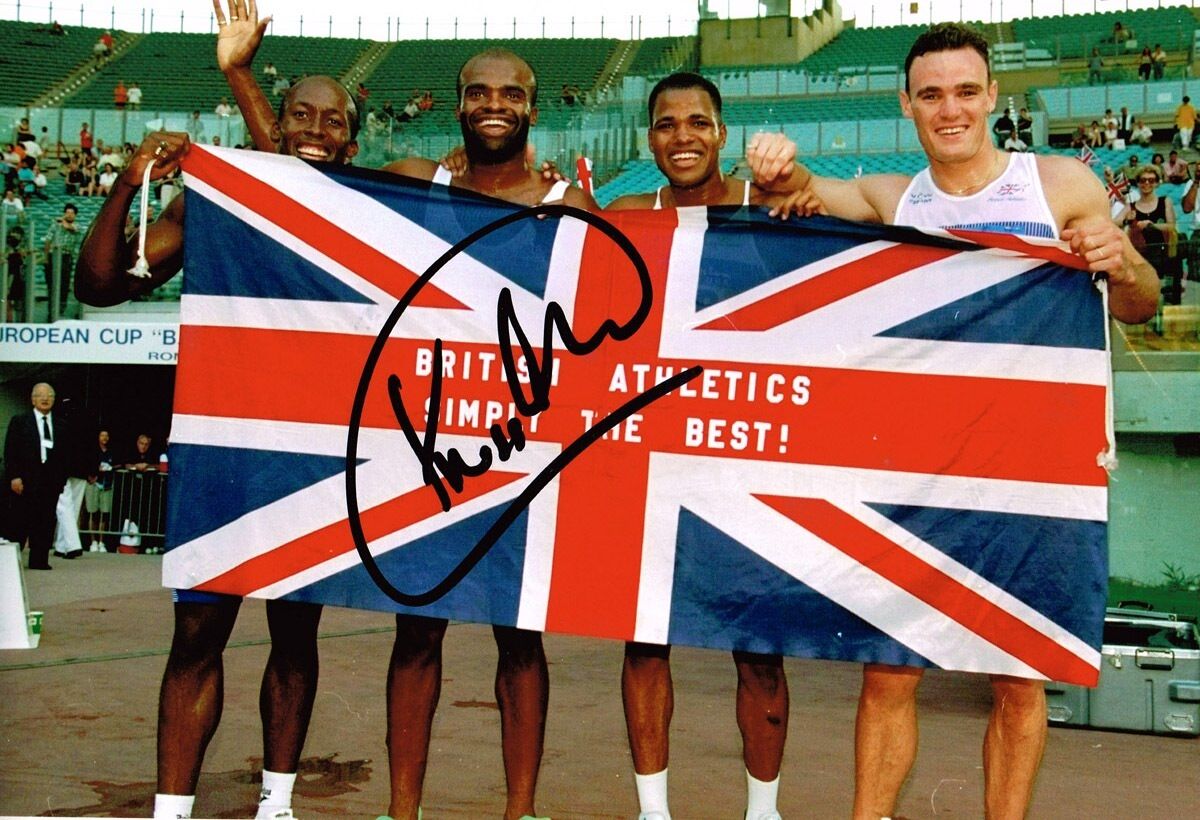 Kriss Akabusi HAND SIGNED Autograph 12x8 Photo Poster painting AFTAL COA British Athlete Posed