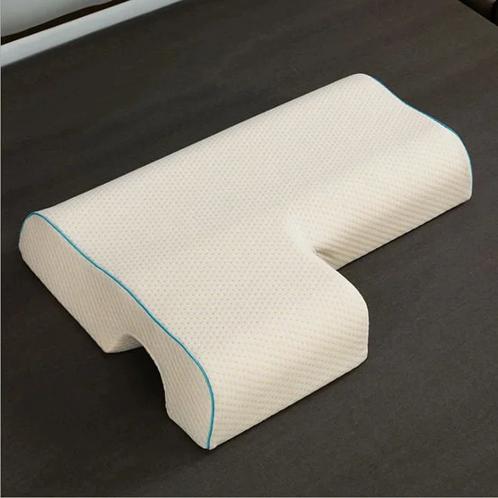 Side sleeper pillow with clearance arm hole