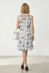 Back view of sophisticated white and blue embroidered lace cocktail dress
