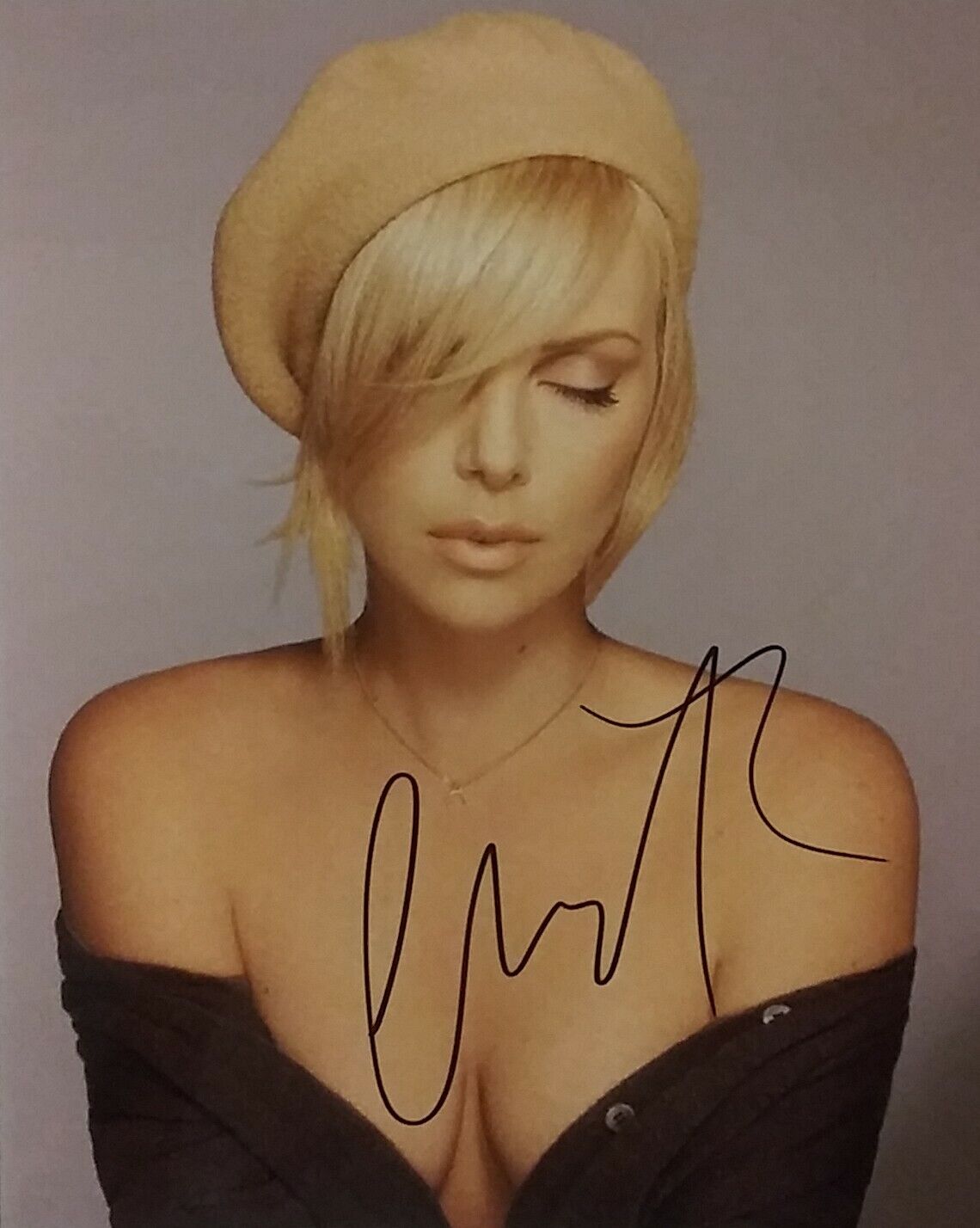 Charlize Theron signed 8 x 10