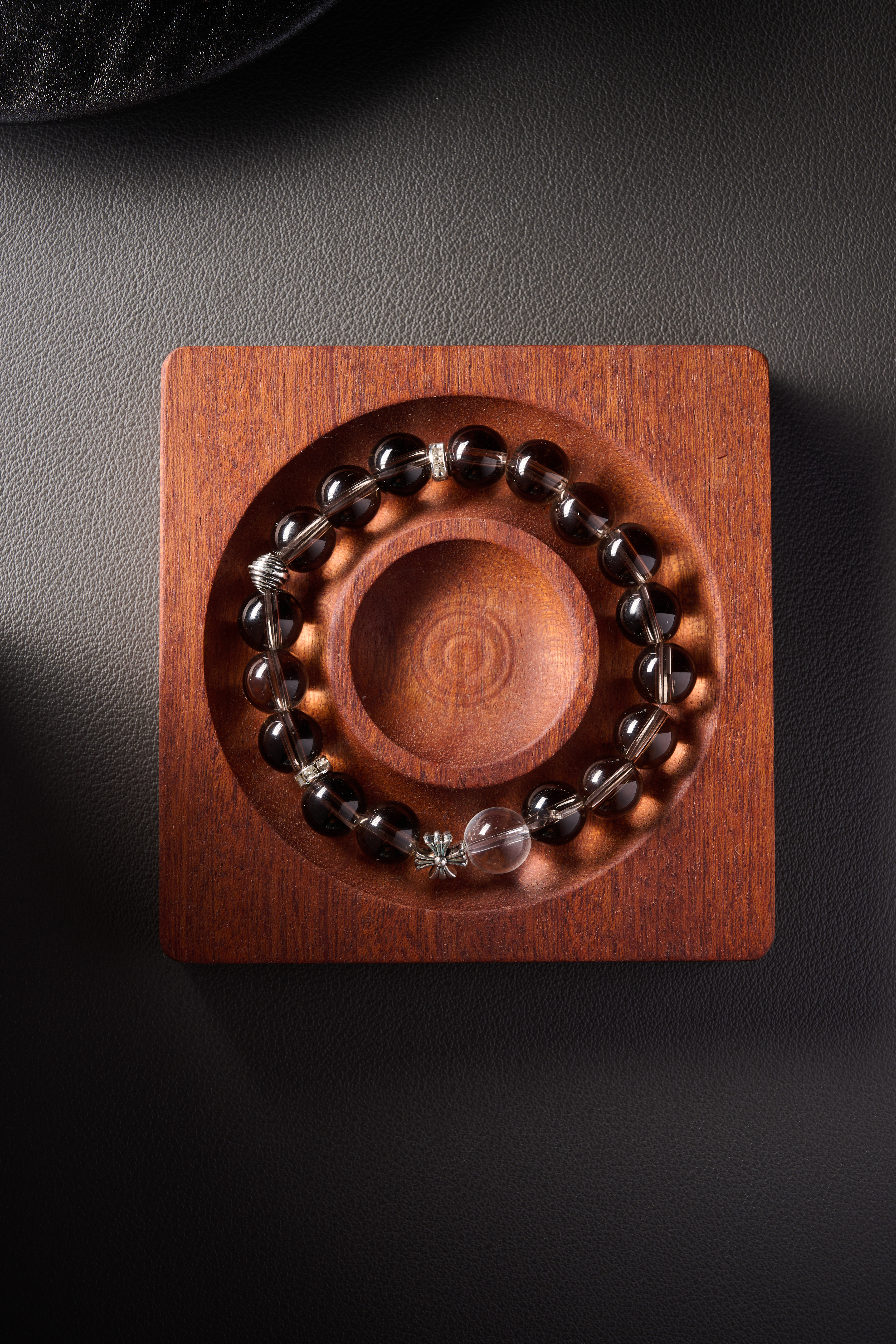 Color contrast – smoky quartz next to a clear quartz accent bead, transparent contrast effect.