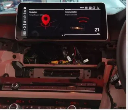 BMW F10 12.3-inch Android display connected before the centre trim is refitted