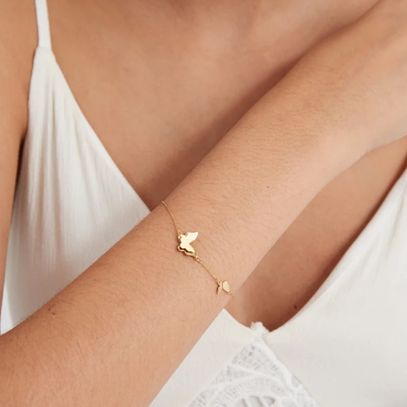 Dainty gold butterfly bracelet featuring a layered butterfly design, adjustable length 