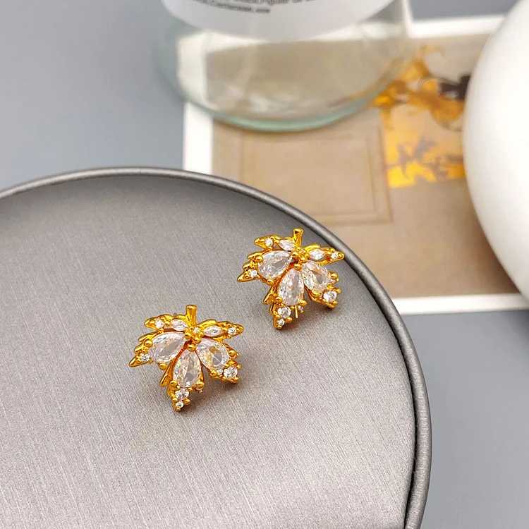 Red maple leaf studded diamond earrings