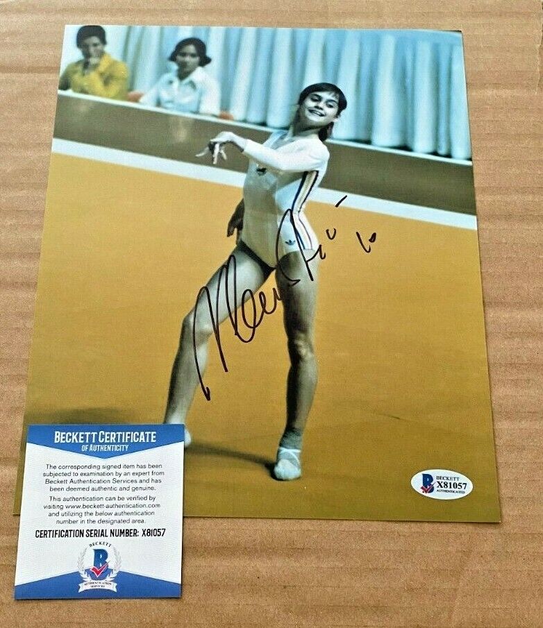 NADIA COMANECI SIGNED OLYMPICS 8X10 Photo Poster painting BECKETT CERTIFIED