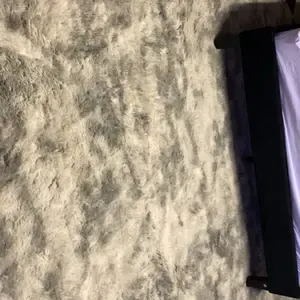 Customer photo: plush cream and tan rug surface in cozy room