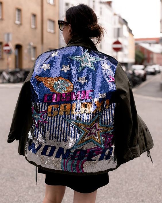 The fashion trend is a beaded print jacket on the back