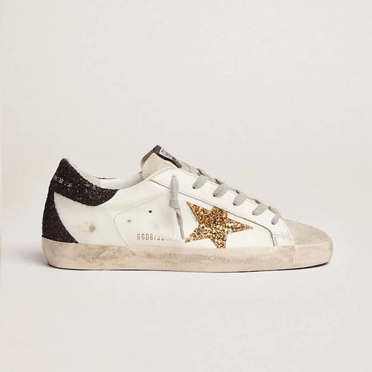 Golden Goose Super-Star Mujer con estrella dorada y refuerzo del talón con purpurina negra