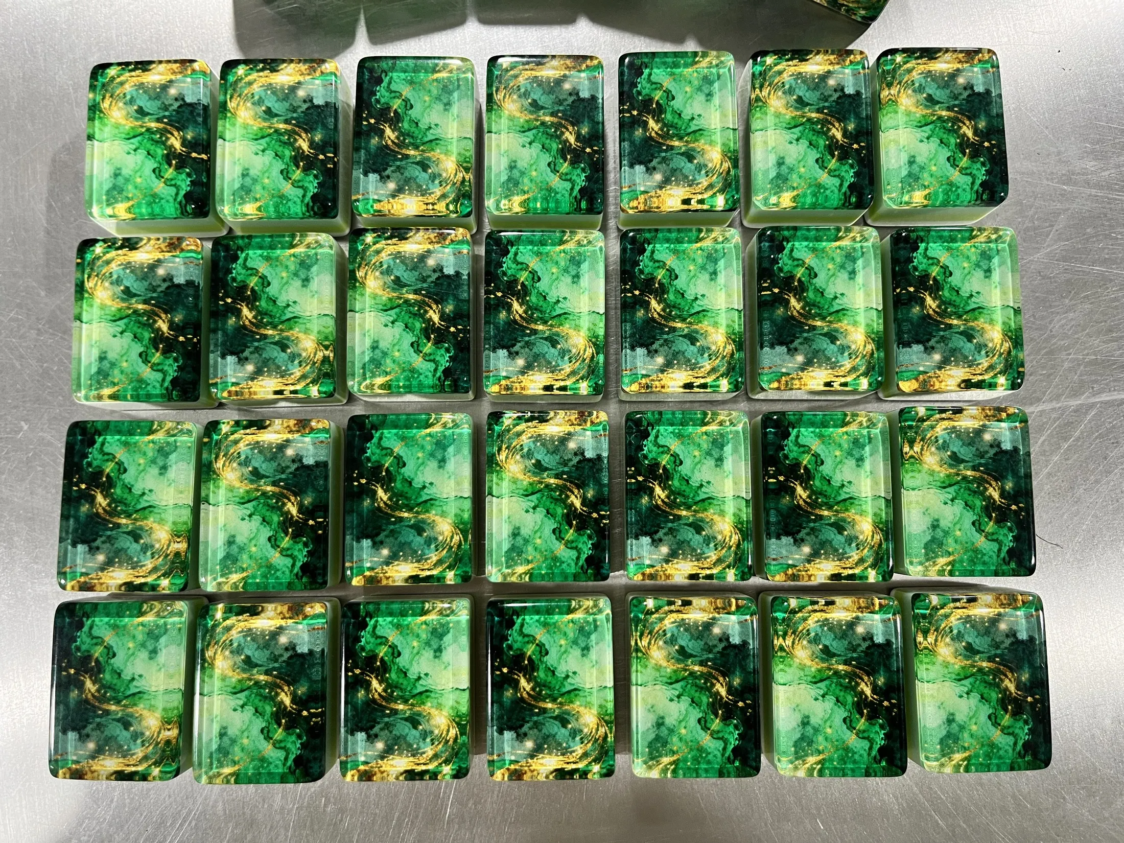 The real set gathered with engraved faces and emerald backs.