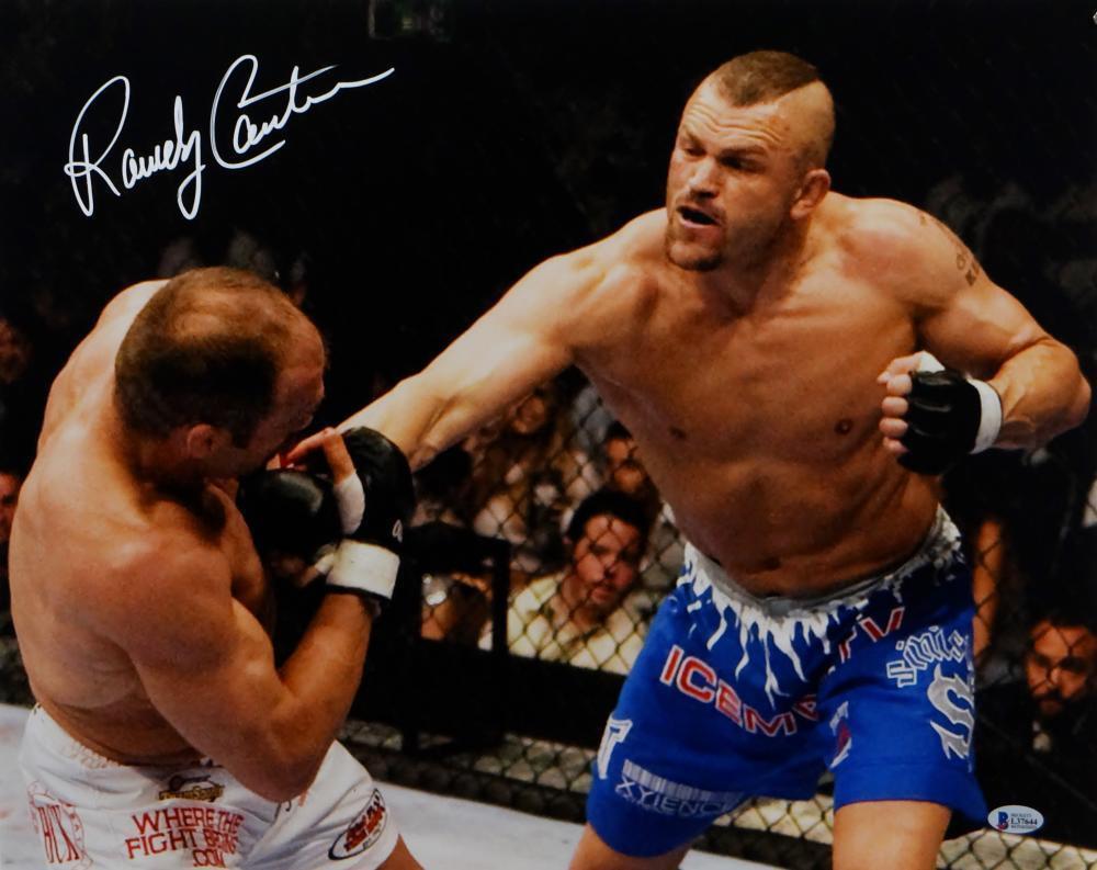 Randy Couture Autographed UFC 16x20 Hit By Liddell Photo Poster painting- Beckett Auth *White