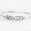 14K White Gold Cuff Bangle Bracelet with Tapered Baguette Cut and Round Cut Diamonds