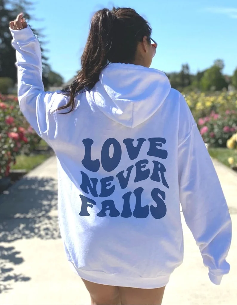 LOVE NEVER FAILS HOODIE