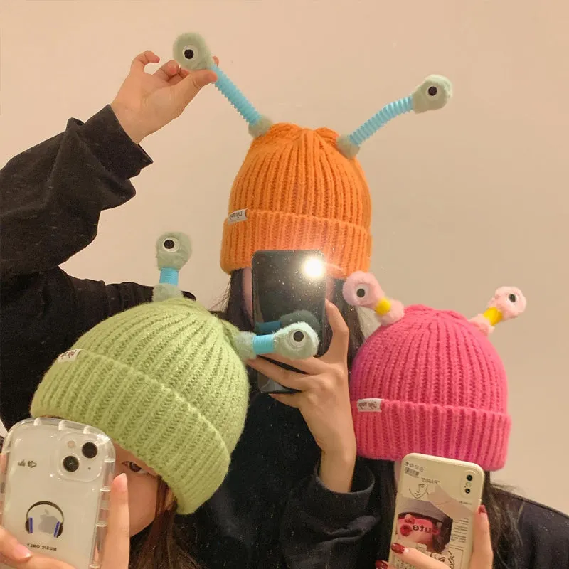 Bonnet aux yeux de monstre brillants